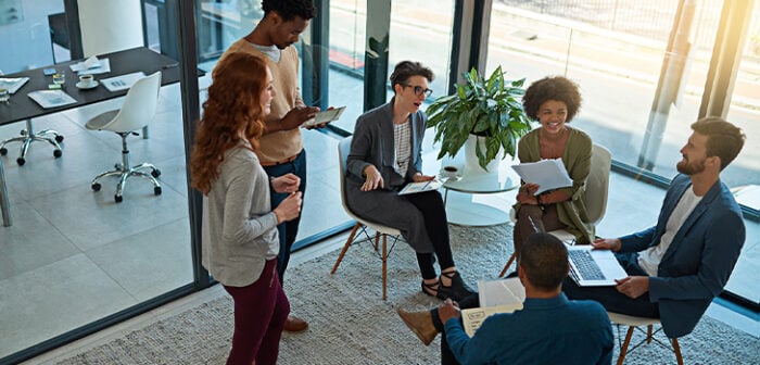 Google Stay and Thrive Case Study hero image of diverse people in a meeting