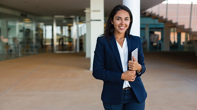 Cheerful businesswoman with digital tablet