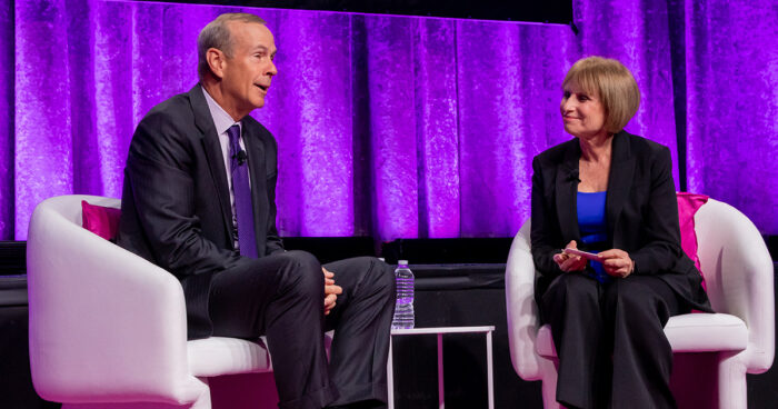 Mike Wirth and Lorraine Hariton on stage seated at the Catalyst Awards