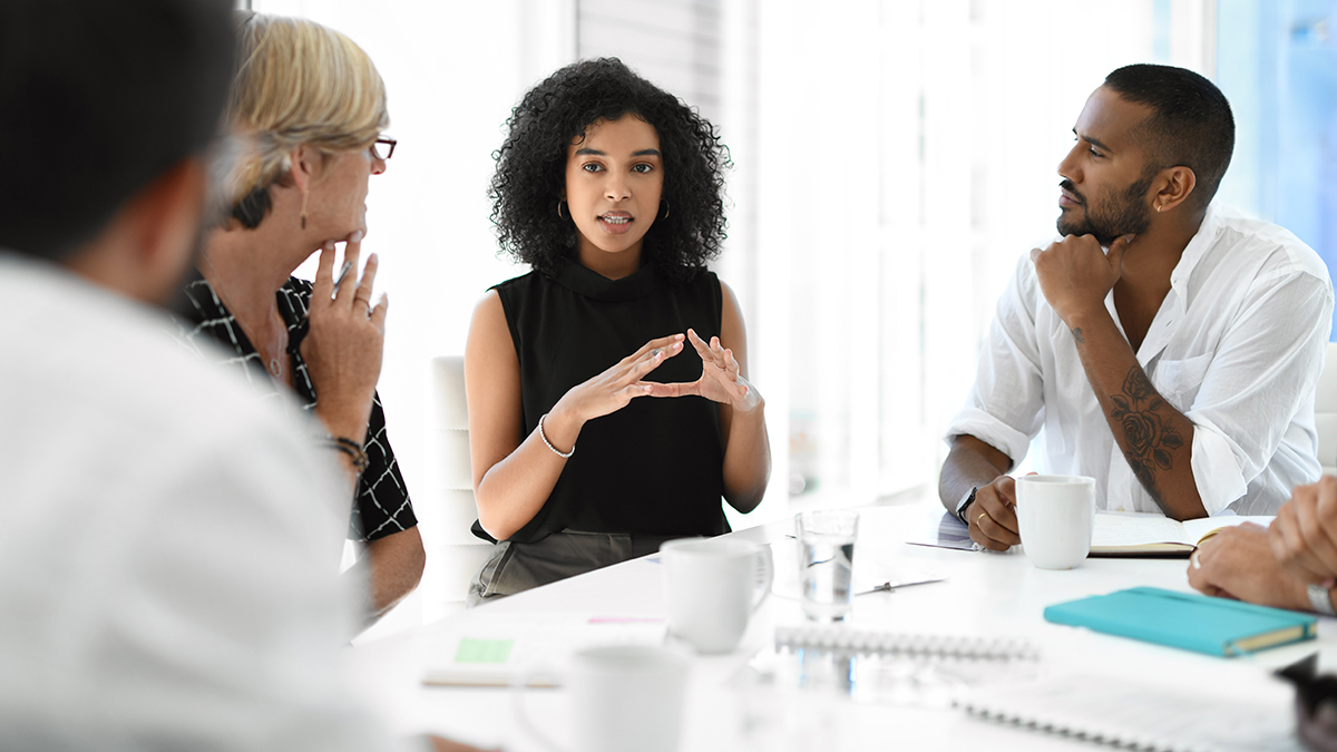 Cropped shot of an attractive young businesswoman brainstorming with her colleagues during a meeting in the boardroom