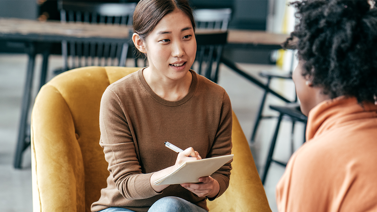Manager conducting a job interview using bias-free hiring tools.