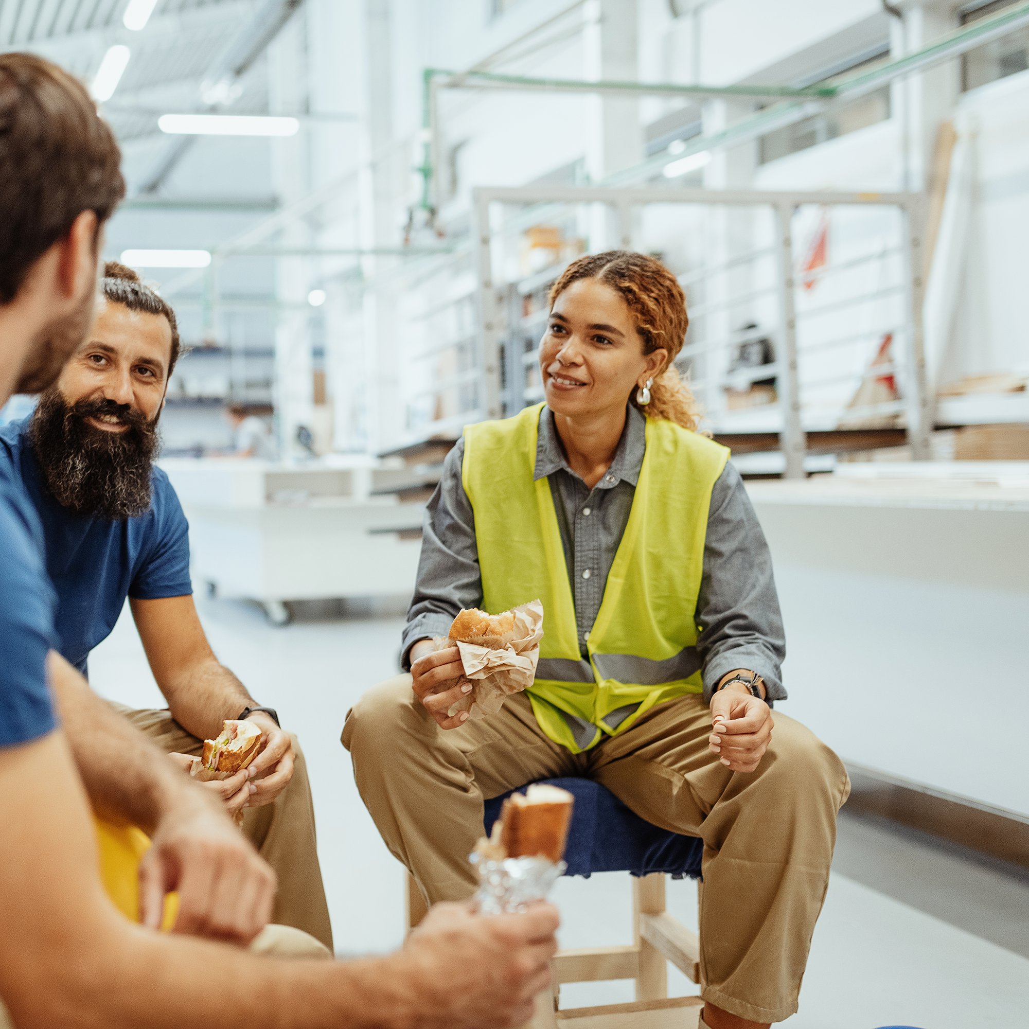 manufacturing employees having lunch together